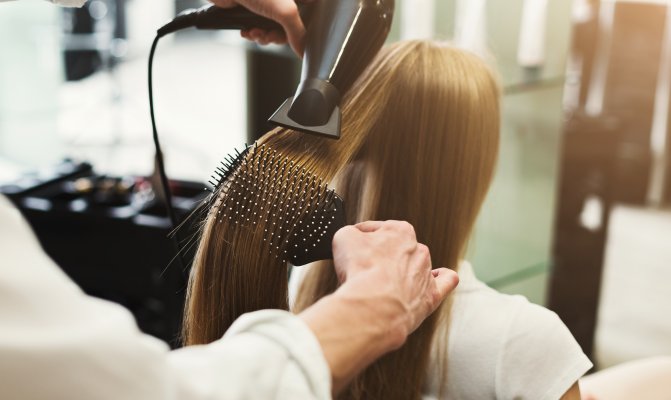 Person getting hair dried in a salon
